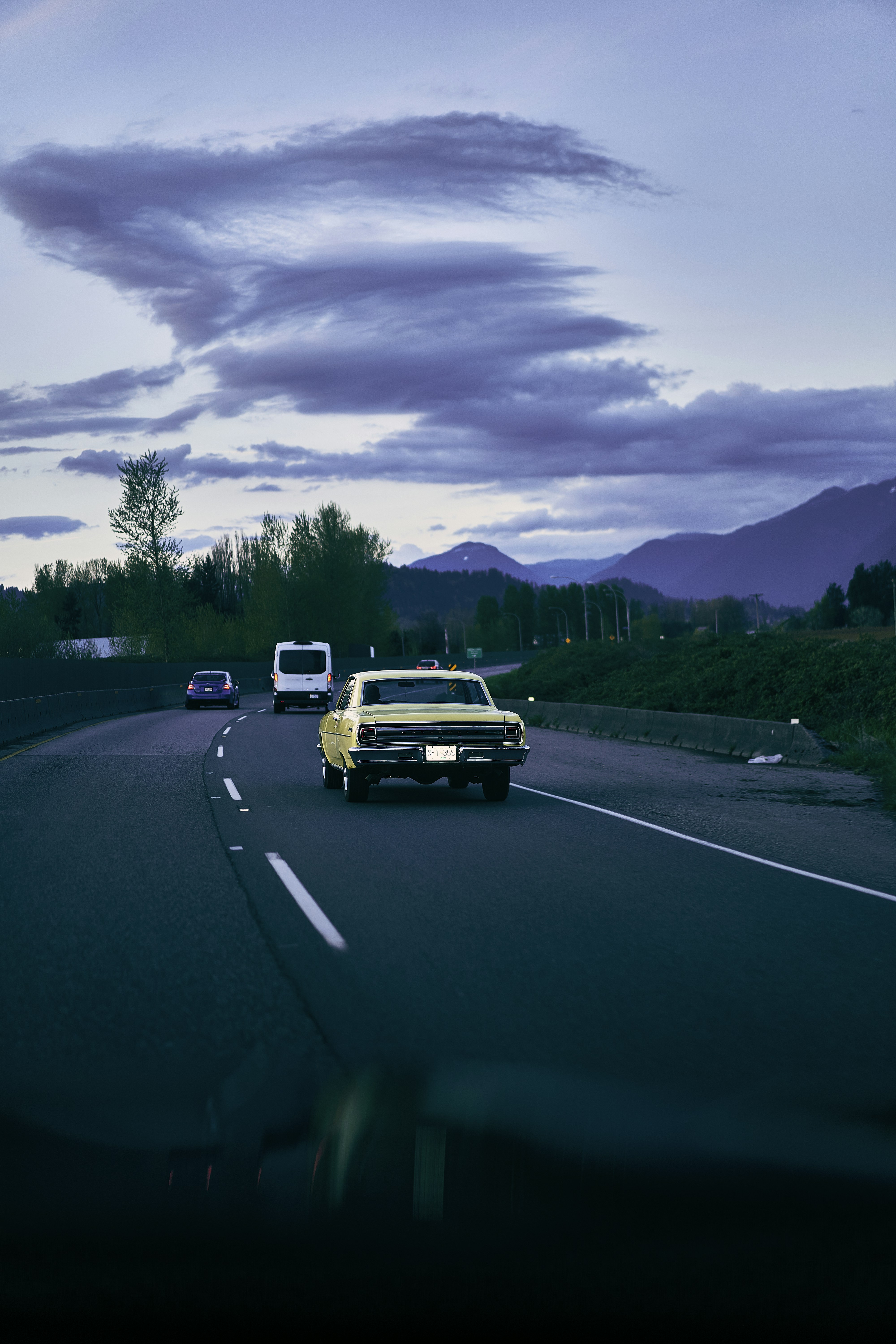a group of cars on a road