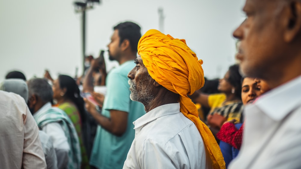a man in a yellow head scarf