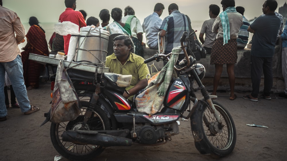 a person sitting on a motorcycle