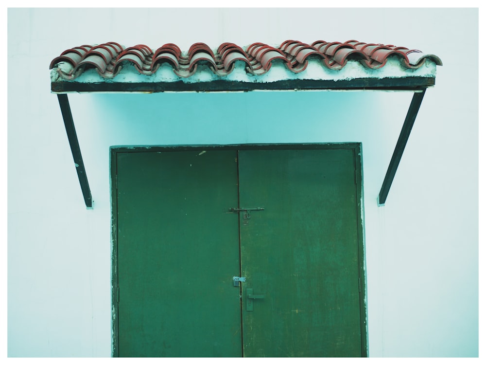 a green door with a red frame