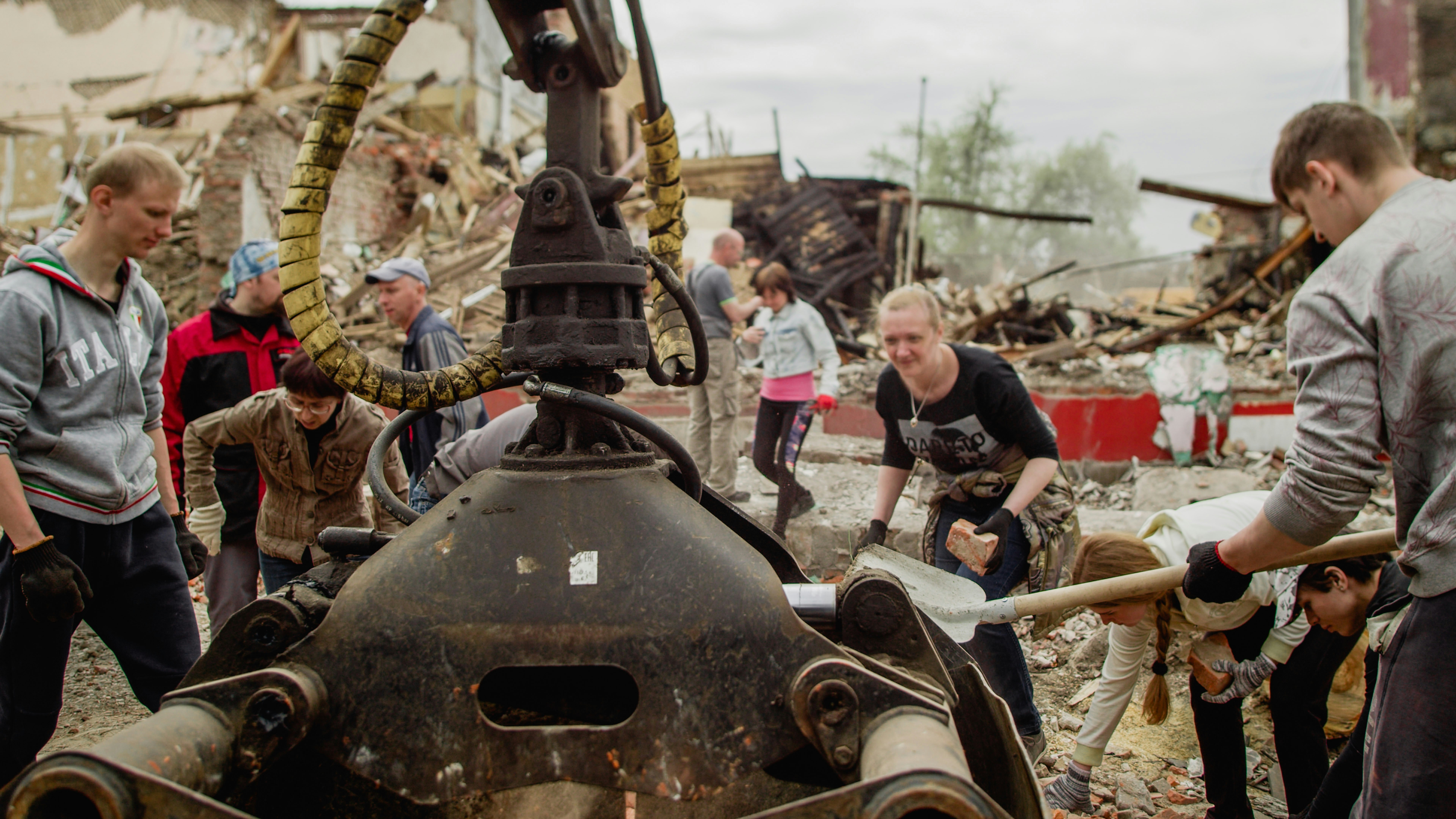 a group of people around a tank