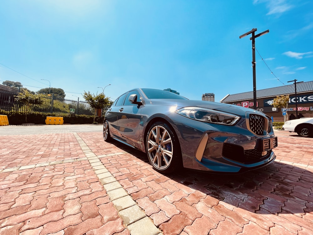 a car parked on a brick road