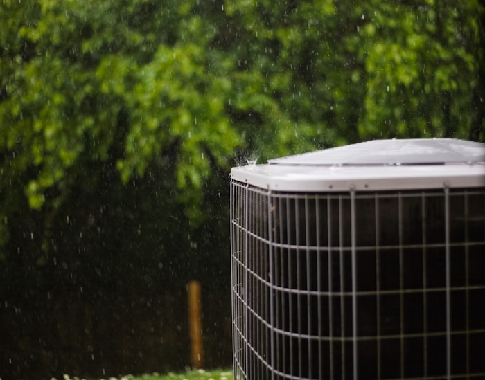 Residential HVAC condenser installed on a pad