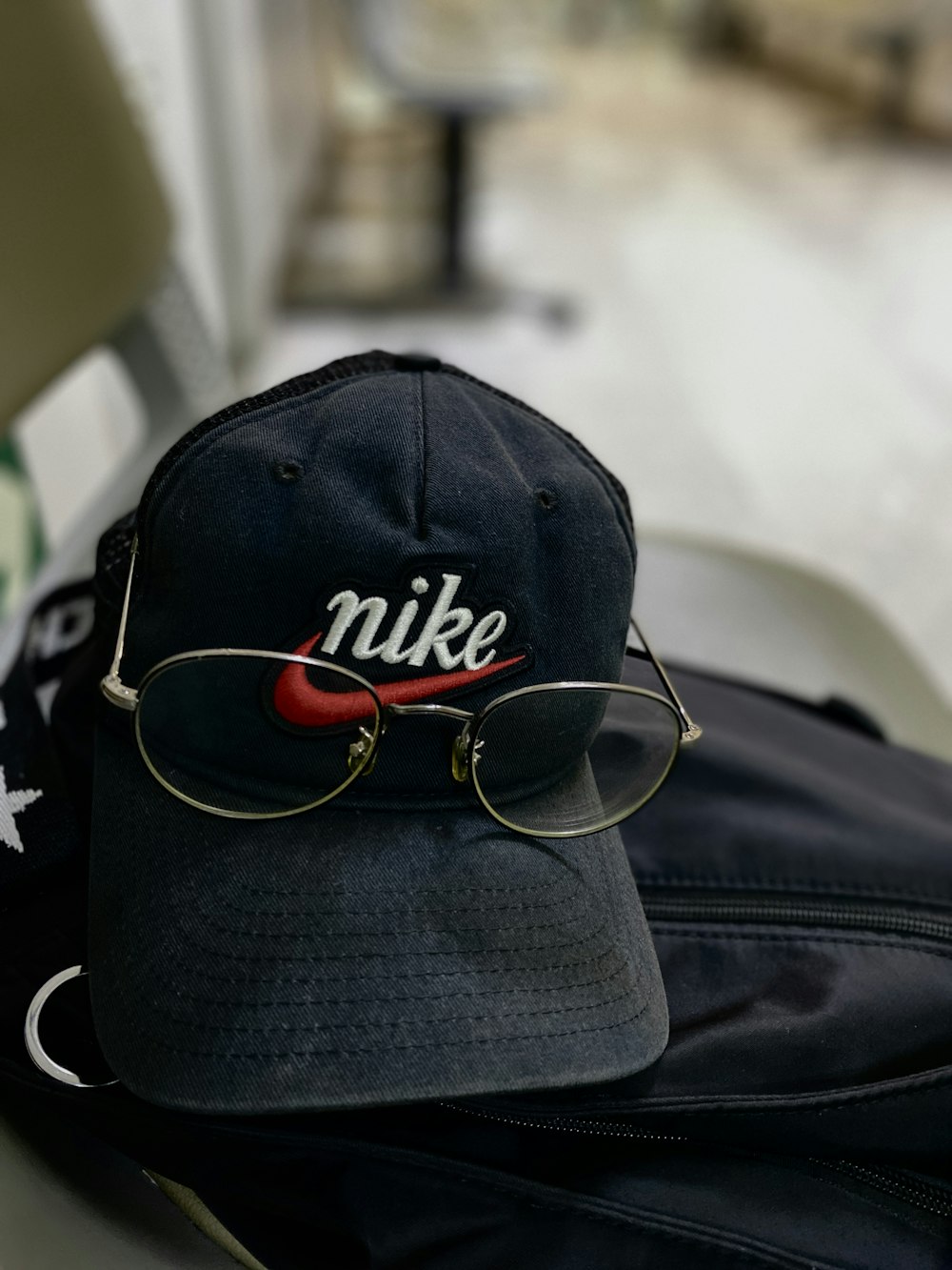 a black hat with a red and white logo on it