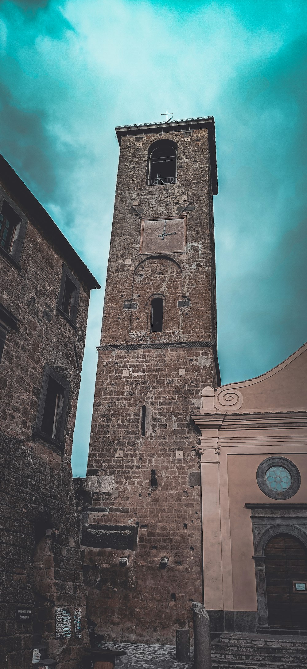 a tall brick building with a clock