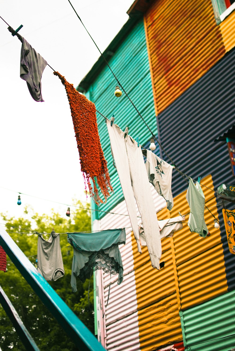 a row of clothes outside of a building