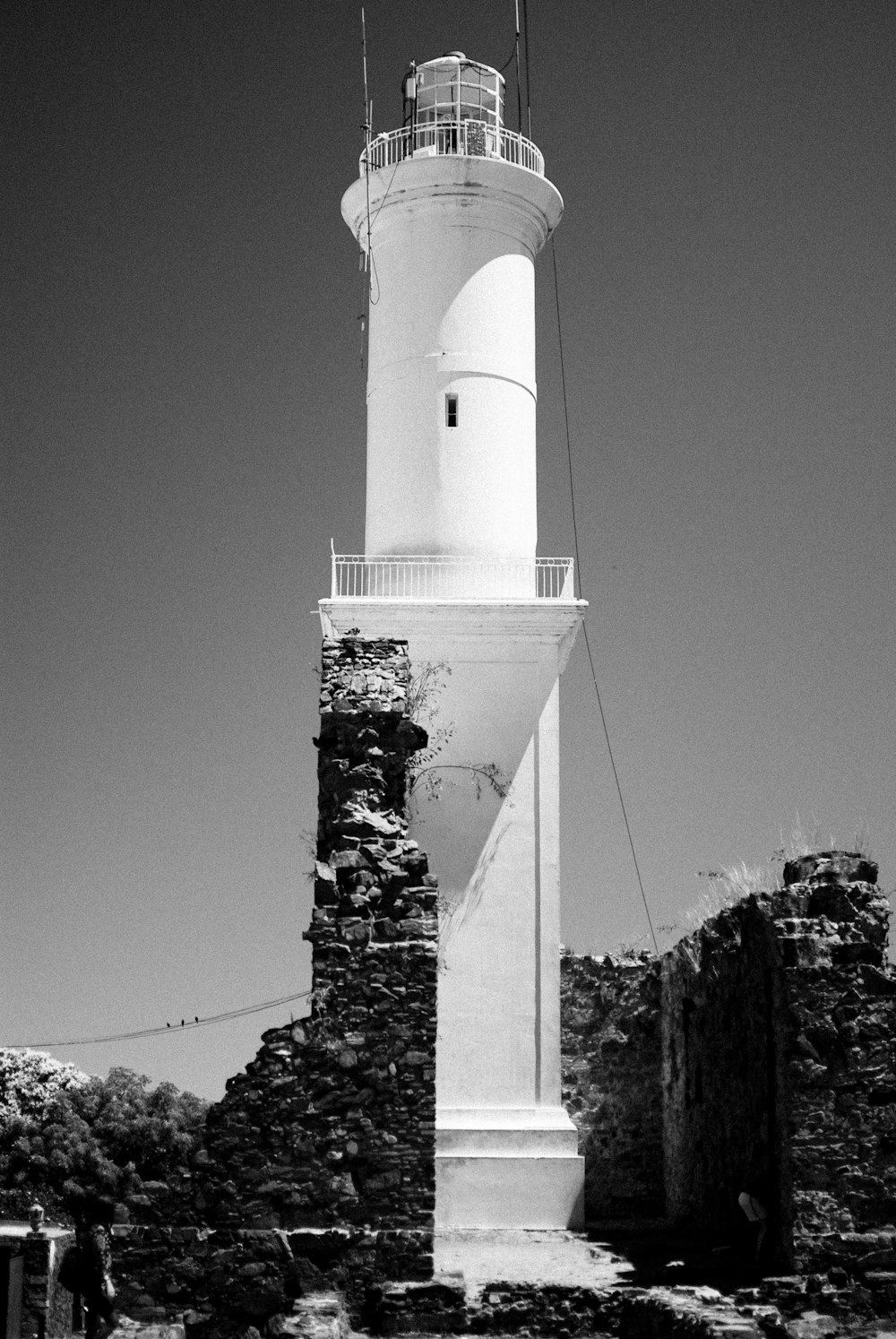 a white tower with a white top