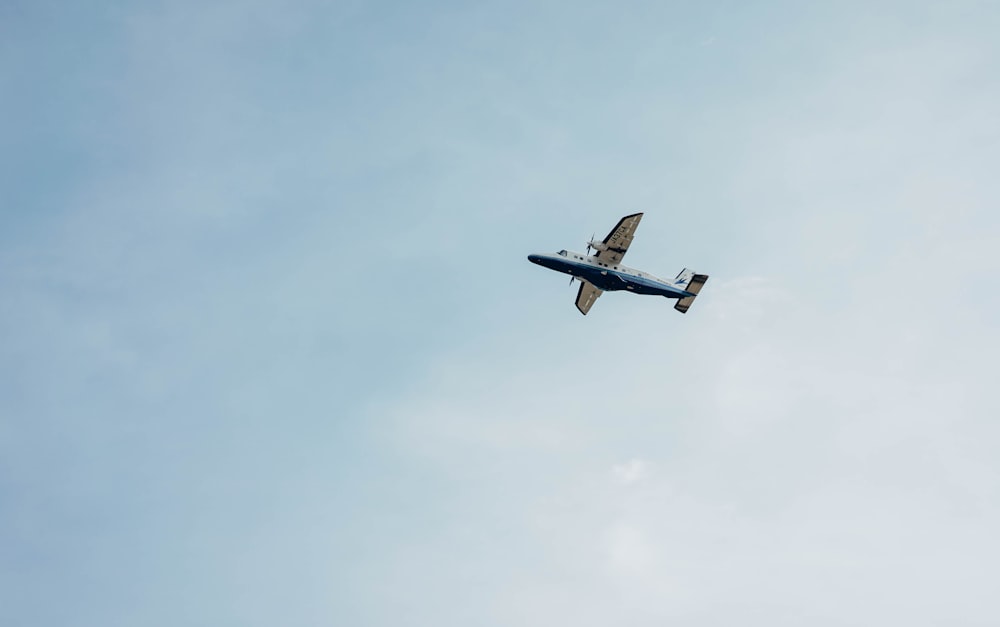 a small airplane flying in the sky