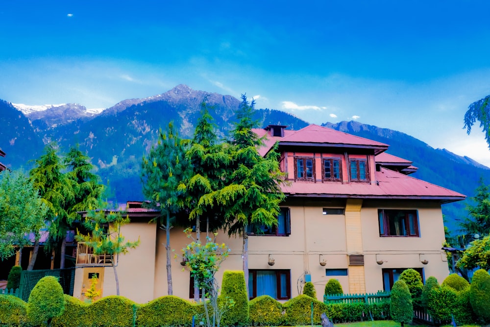 a large house with trees in front of it