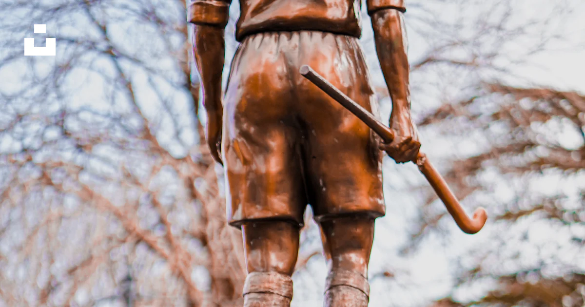 Sword Railing A statue of a person holding a sword on a railing photo – Free Best ...