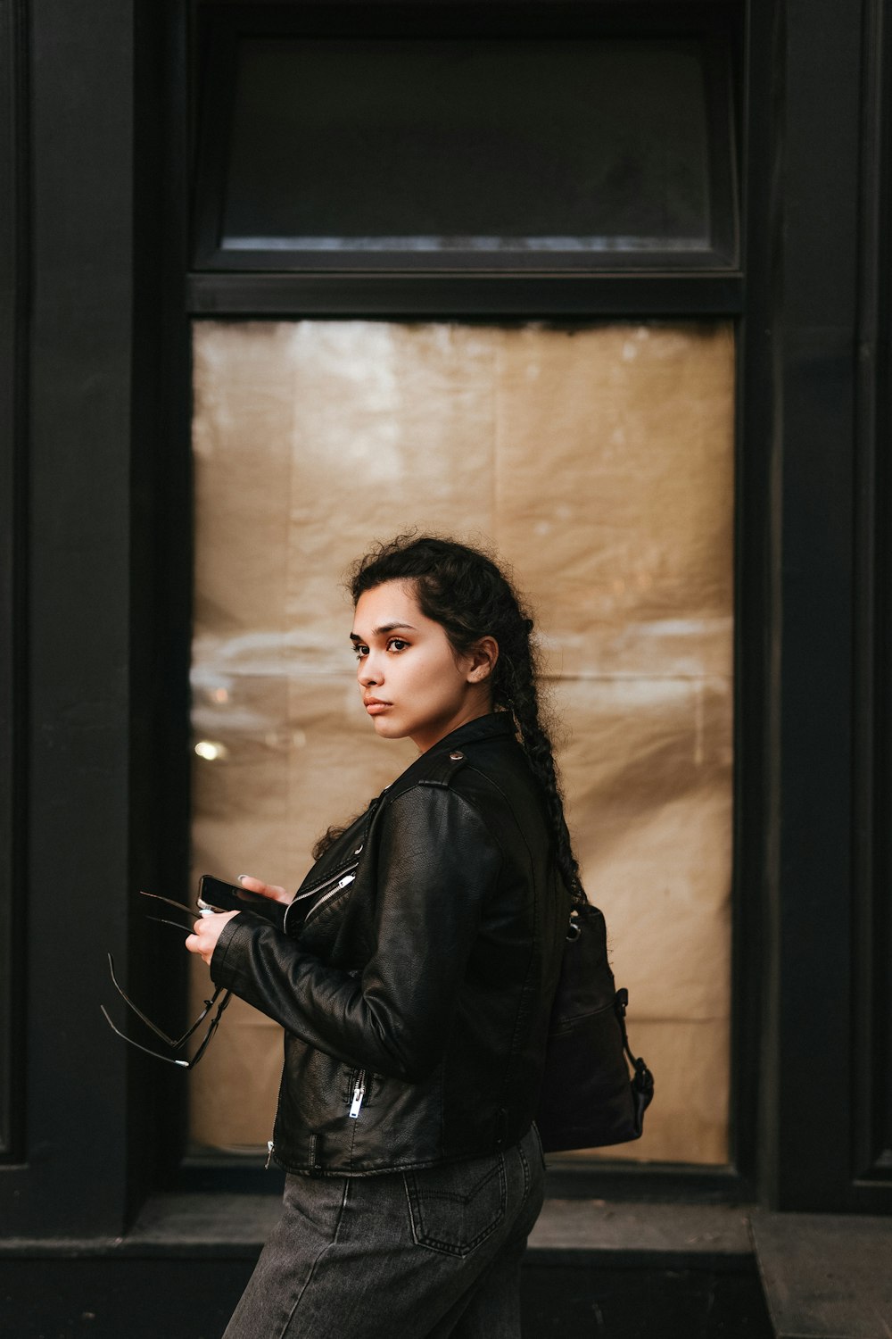 a woman in a leather jacket