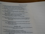 A close-up view of a page from a book, displaying text from Psalm 46:9. The text includes verses with references to topics like beauty, gifts, joy, and the palace of the king. The page has a cream-colored background with black printed text.