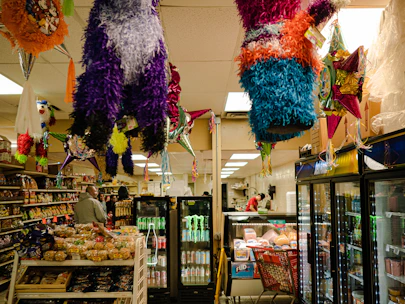 a store with a large display of colorful balloons