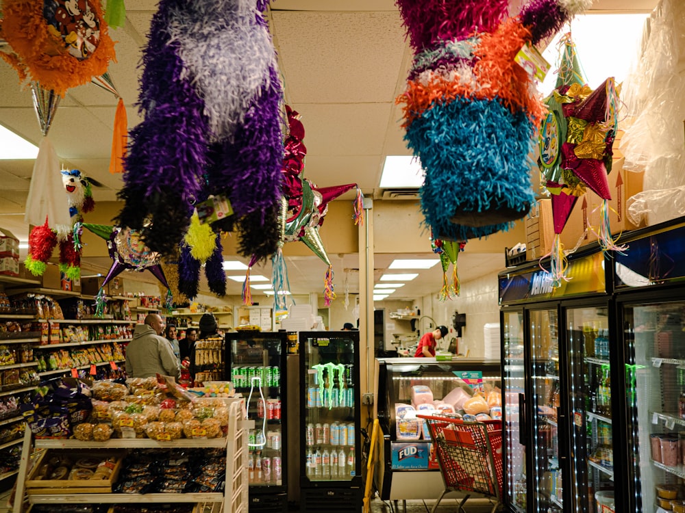 a store with a large display of colorful balloons