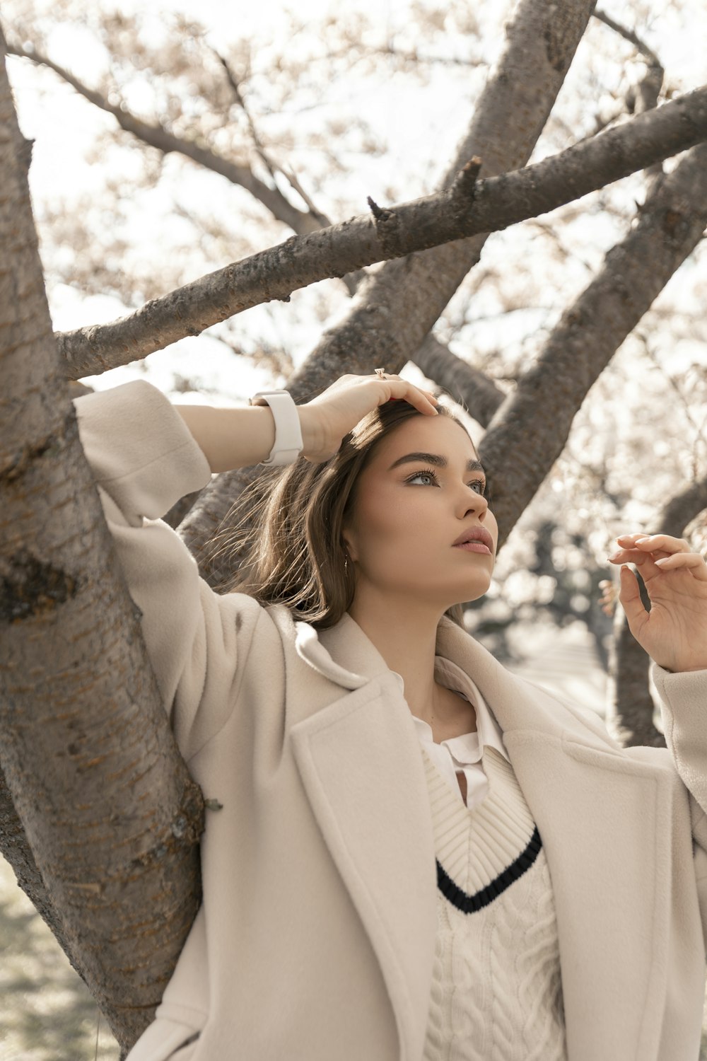 a woman in a white coat