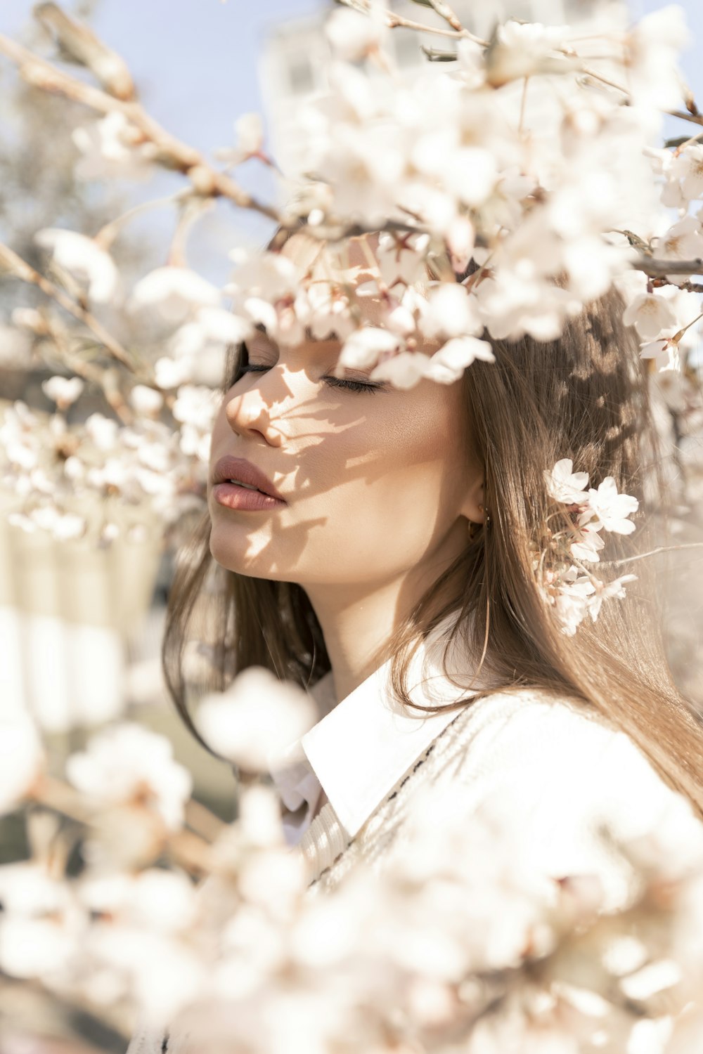 a woman with her hair blowing in the wind