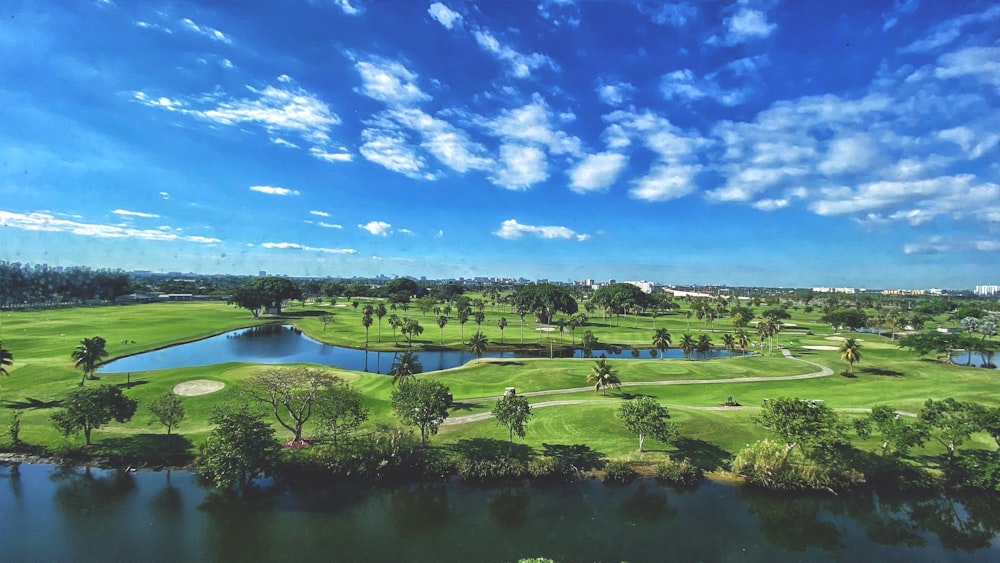 a golf course with a pond