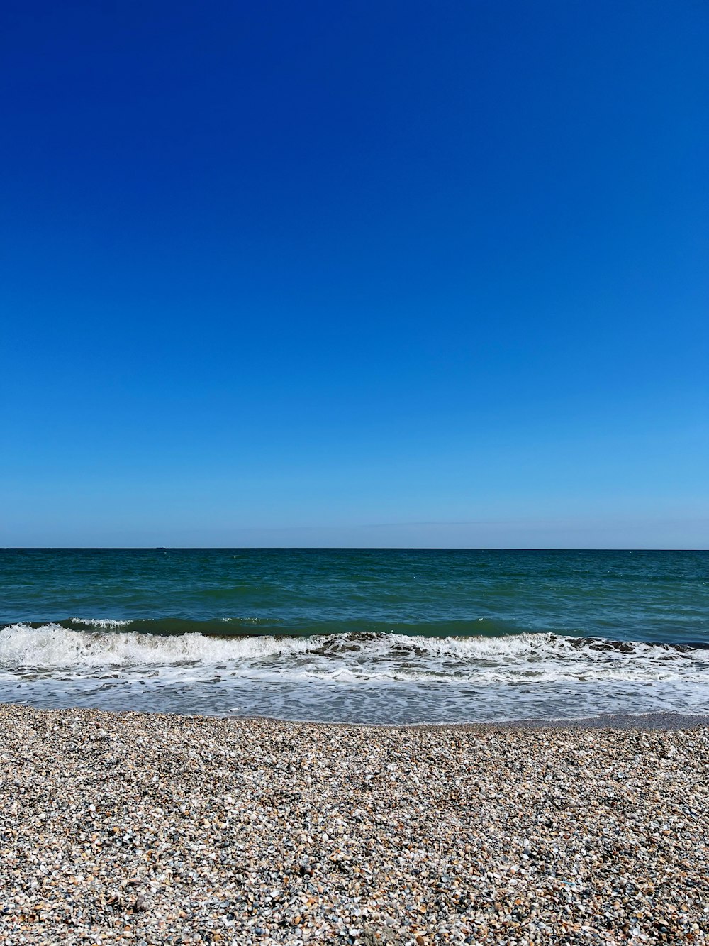 a rocky beach with waves