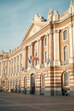 a building with flags on the front
