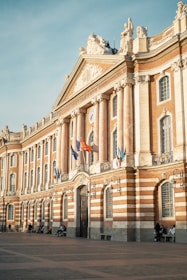 a building with flags on the front