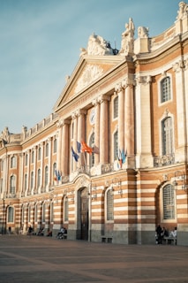 a building with flags on the front