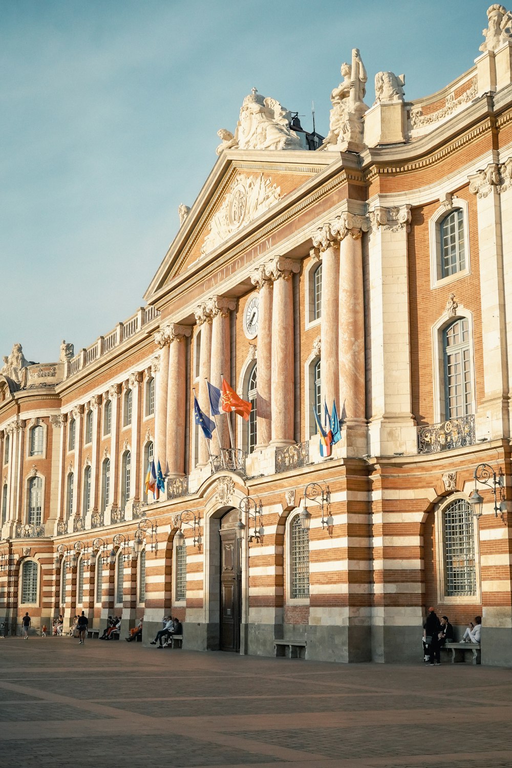 a building with flags on the front