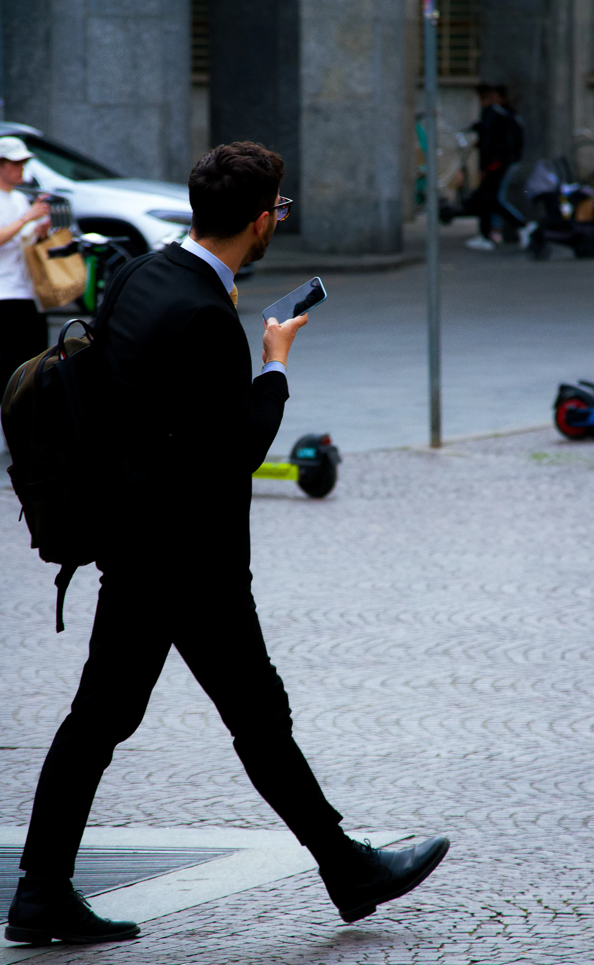 A person quickly scrolling through a small business website on a smartphone while walking