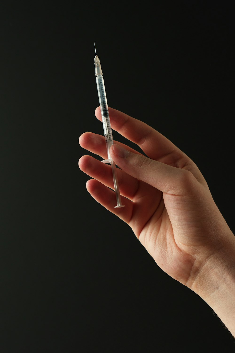 a person holding a needle