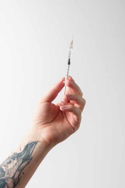 a person holding a needle
