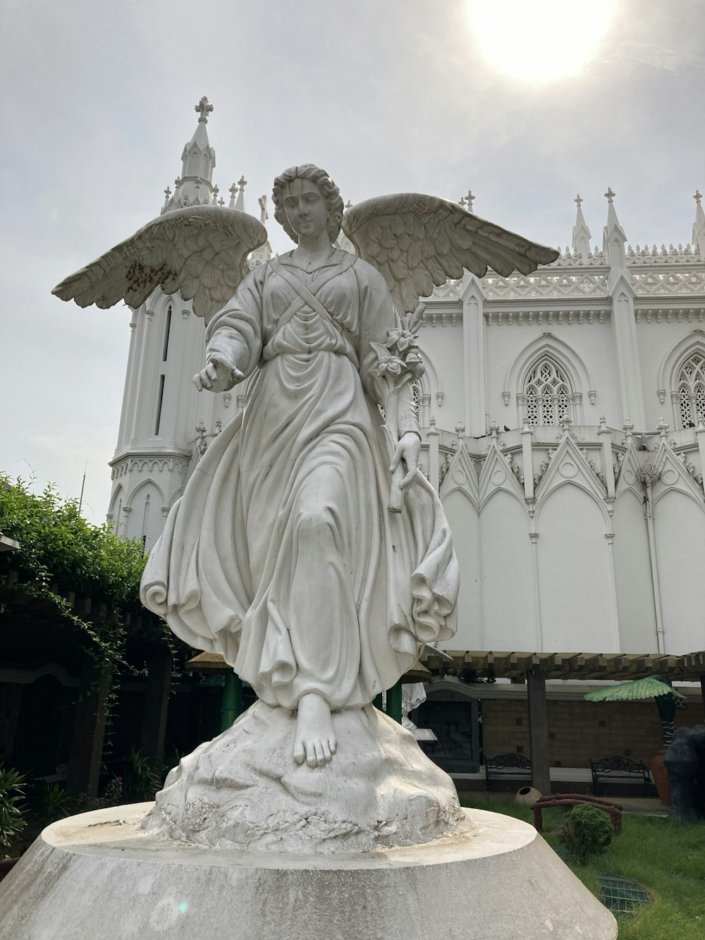 a statue of a person holding a cross