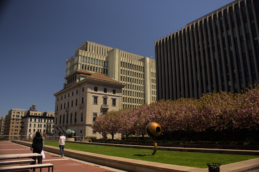 a tall building in a city park