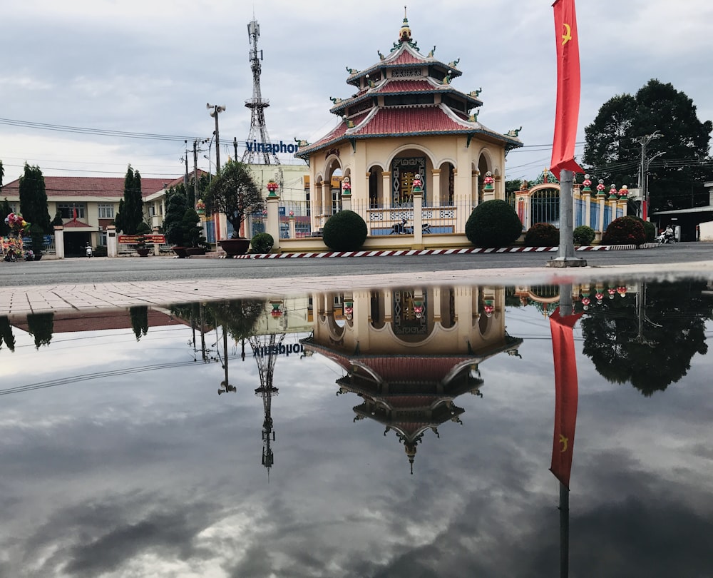 a fountain with a building in the background