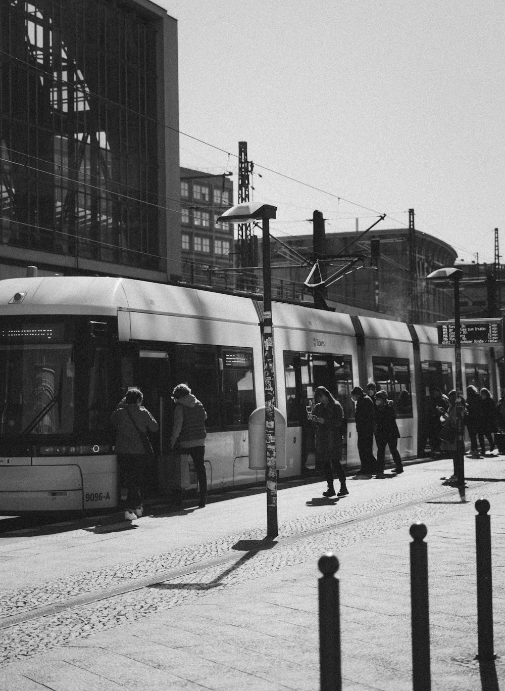 a group of people waiting for a train