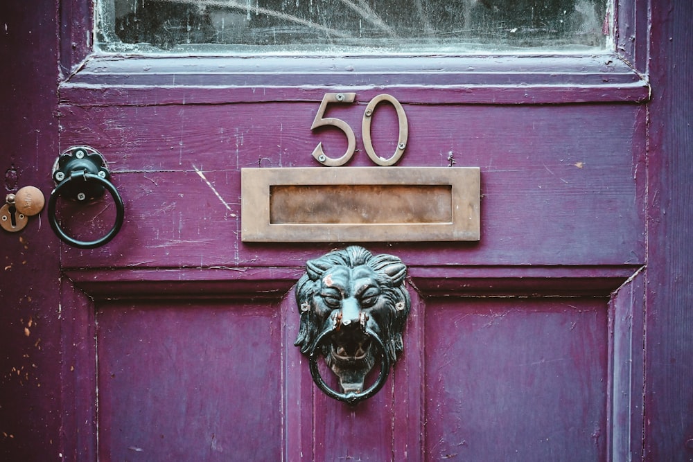 a door with a skull and a key on it