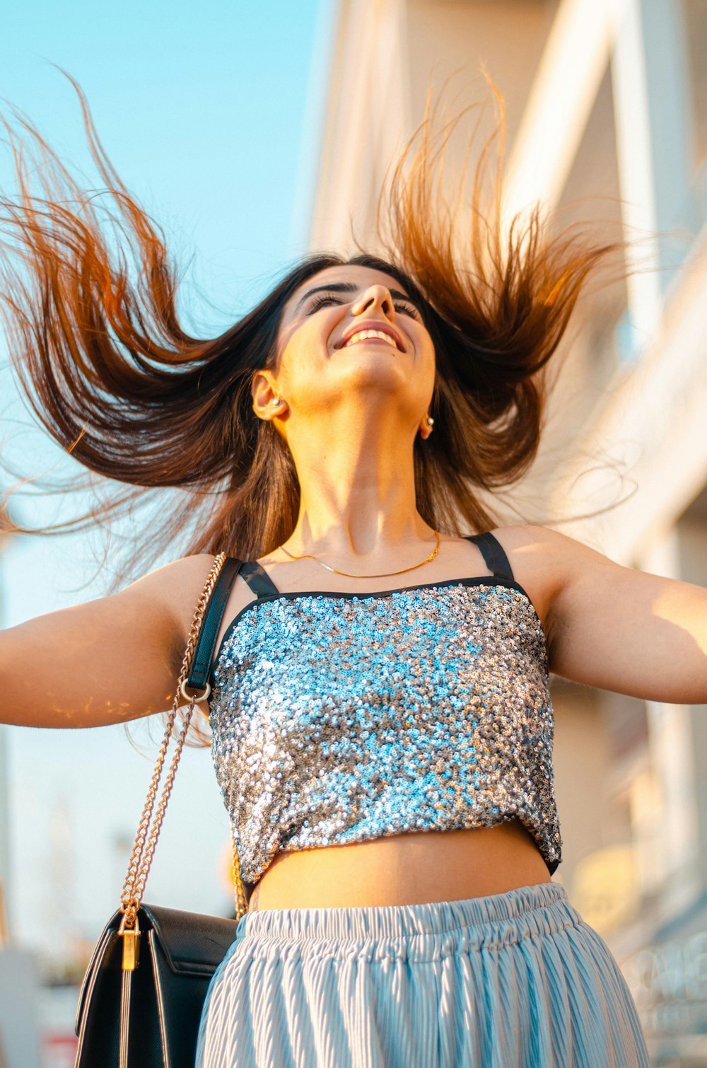 a woman with her hair blowing in the wind