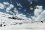 a ski lift going up a snowy mountain
