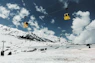 a ski lift going up a snowy mountain