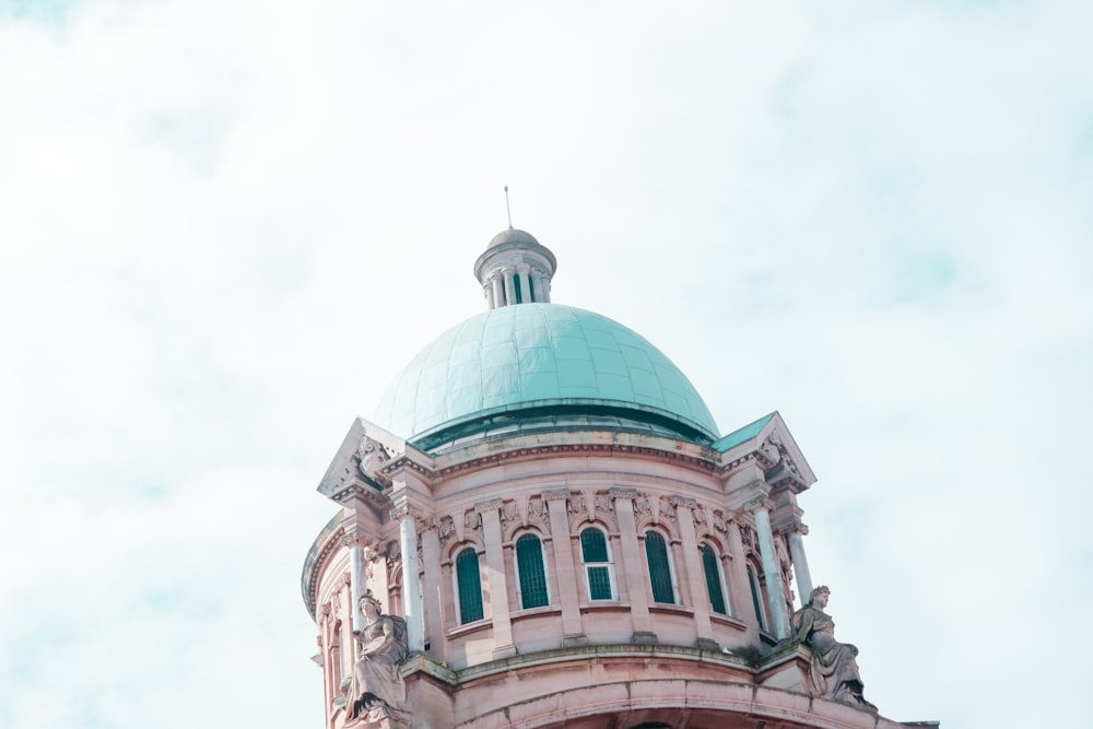 a building with a dome and statues