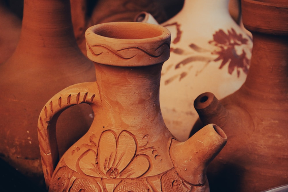 a close up of a clay vase