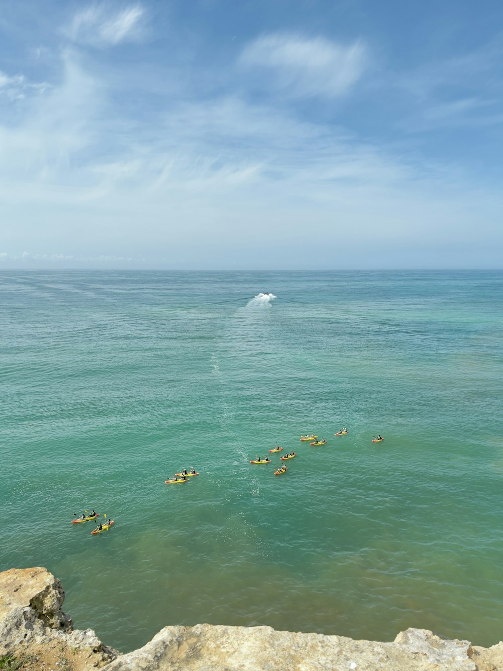 a group of people swimming in the ocean