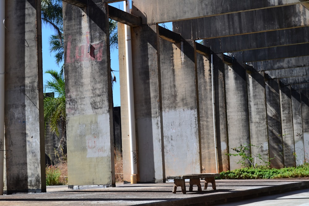 a bench under a bridge