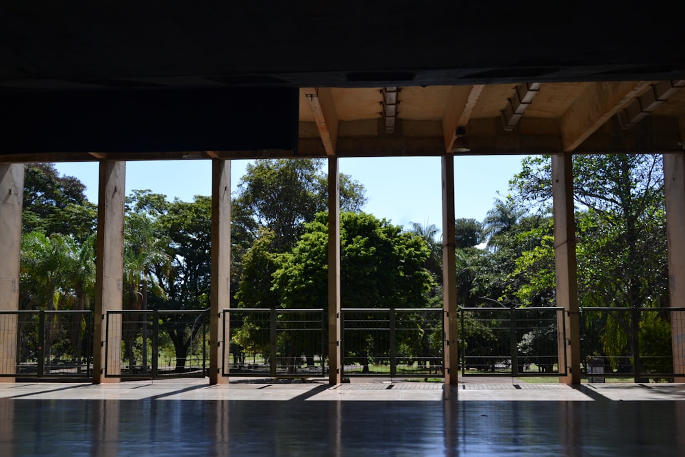 a large glass covered patio with trees