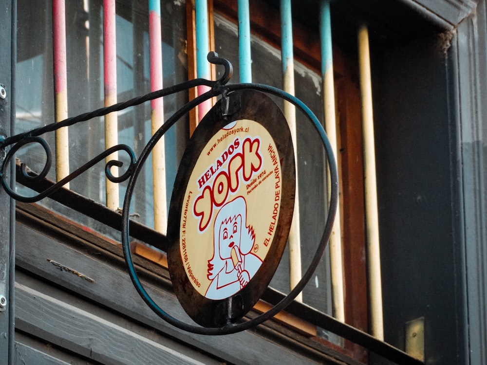 a sign on a metal fence