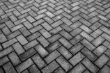 a cobblestone road with a pattern of stones