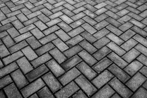 a cobblestone road with a pattern of stones