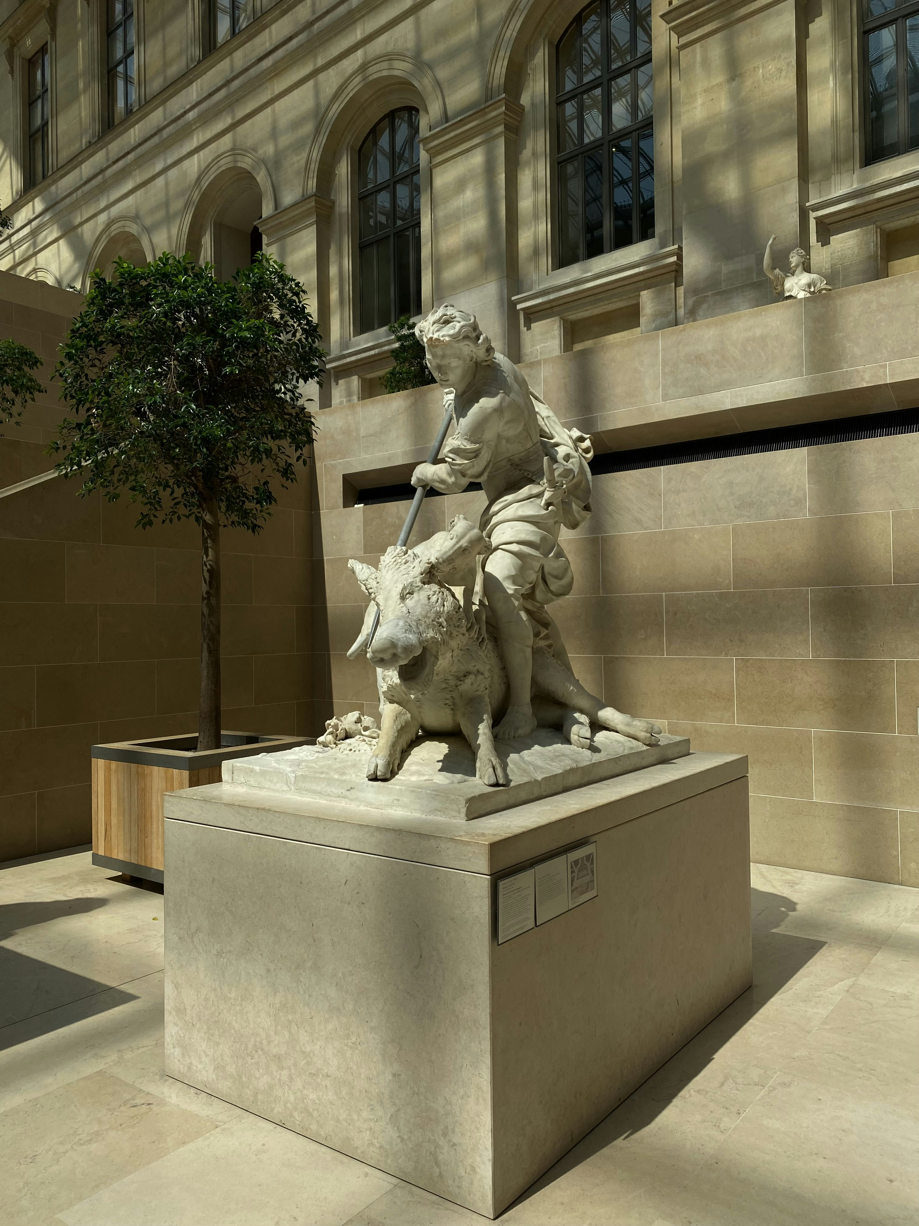 a statue of a person riding a horse