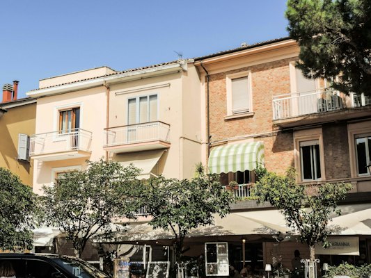A building with trees and bushes — Rimini, Italy