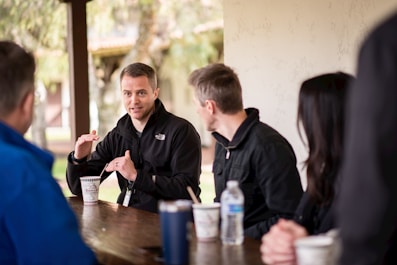 a group of people sitting at a table