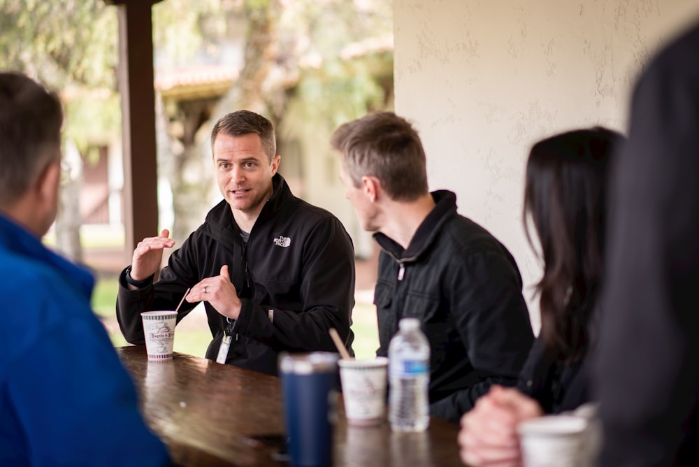 a group of people sitting at a table