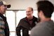 A smiling senior HR leader engaged in a thoughtful conversation during a vip hr collective event.